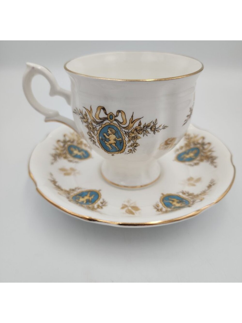 Royal Stafford "Cupid" Bone China England Tea Cup & Saucer Blue Gold White
